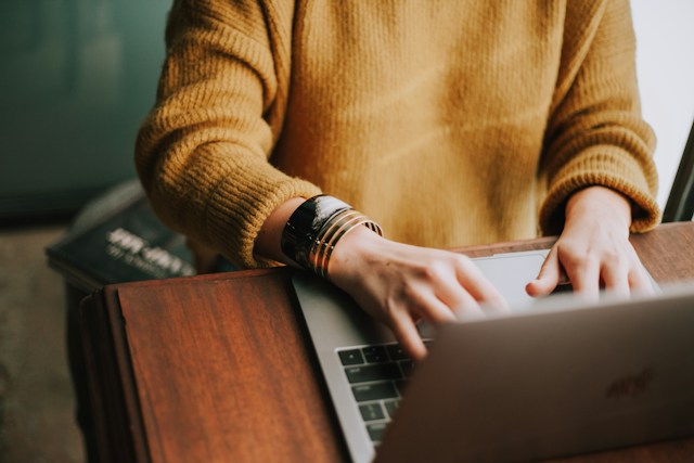 Person at a desk using a laptop